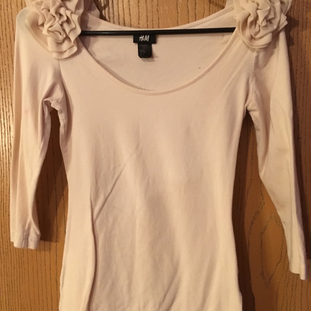 Off white shirt with flowered ruffle detail